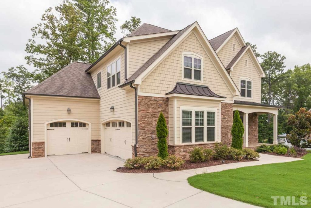 Gorgeous custom home in sought after 12 Oaks community! Open floor plan with gourmet kitchen, hardwood floor throughout the first-floor, crown molding, coffered ceilings, built-ins, and first-floor guest suite. Large master suite on the second floor as well as three spacious secondary bedrooms. Third-floor attic plumbed for bath. Large private cul-de-sac lot, screen porch, 3-car garage.