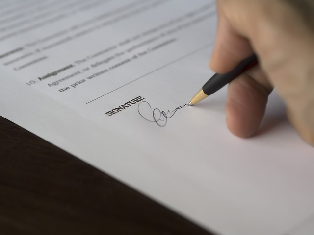 A North Carolina Homebuyer Signing a Real Estate Contract